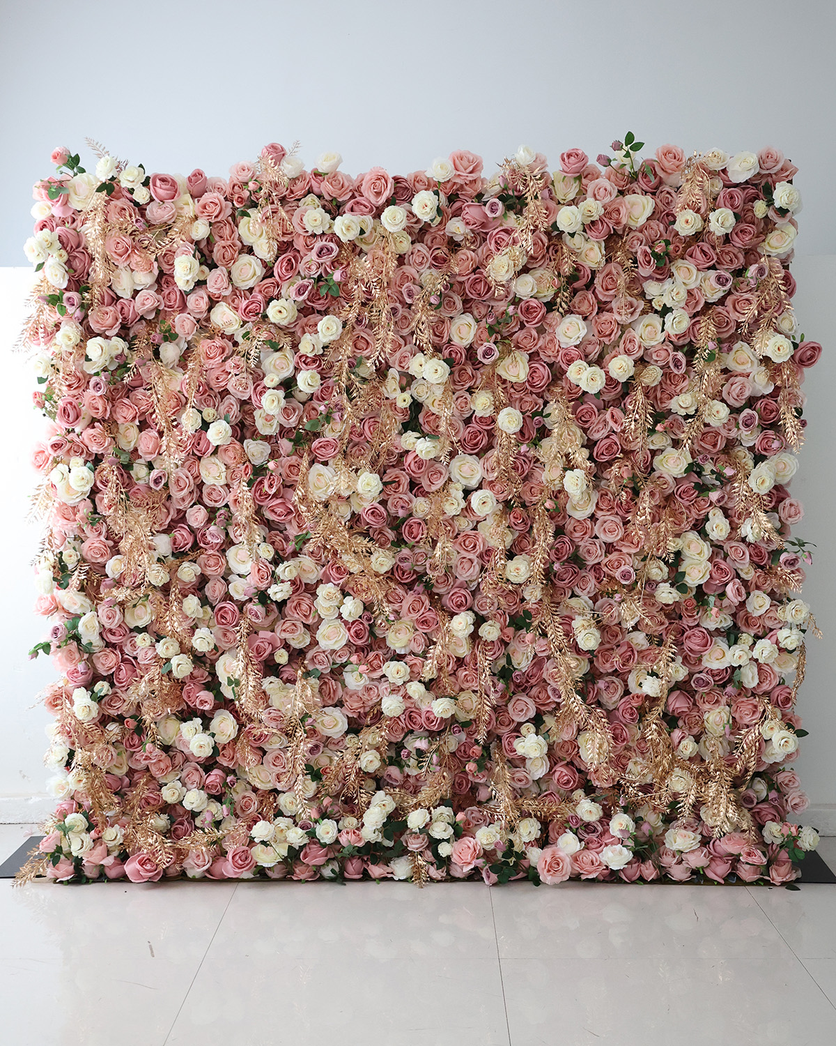 Rose, blush, and cream flower wall rental with gold accents